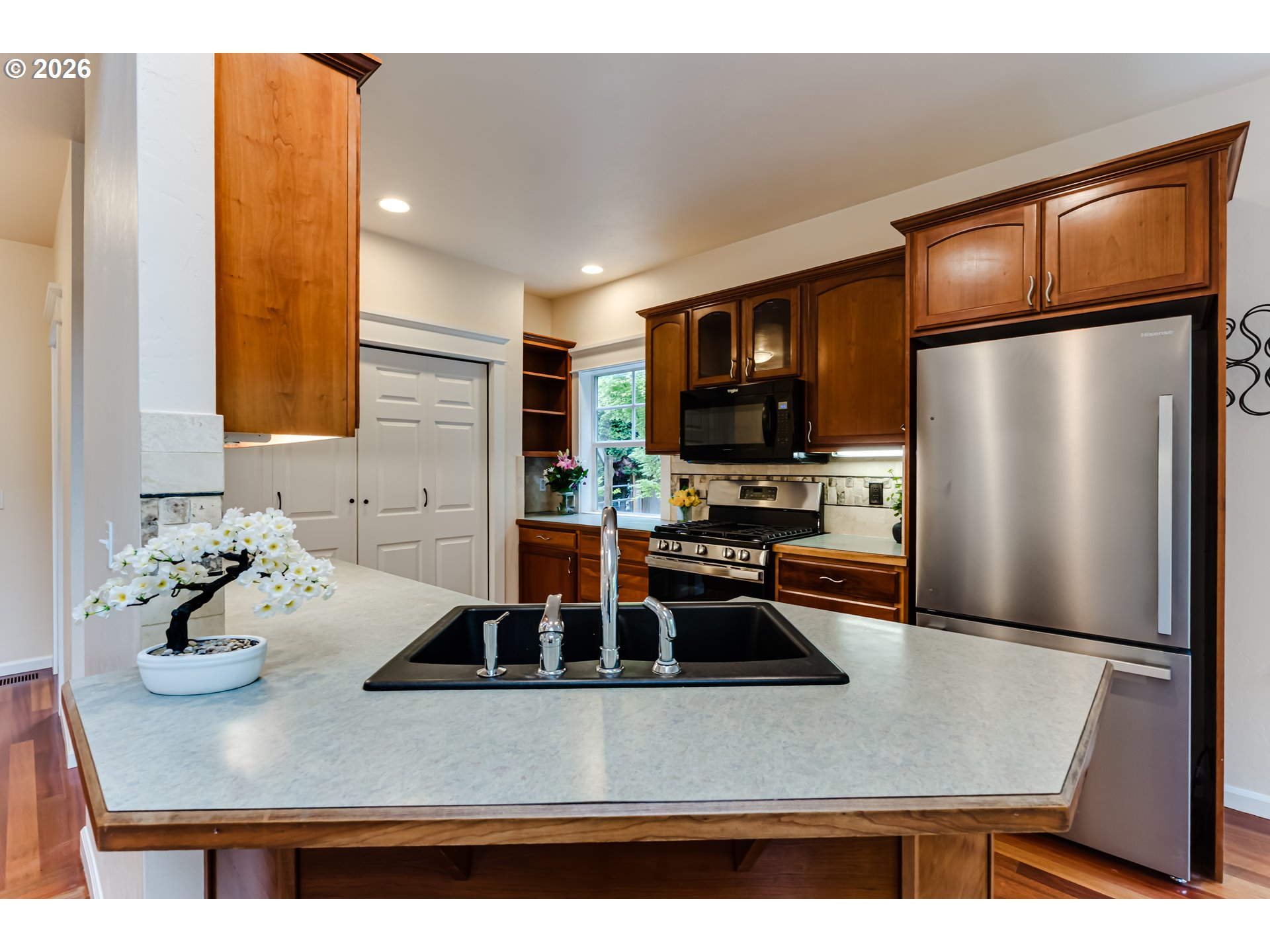 3769 Julia Loop Eugene, OR 97404 - Photo 12 of 46 a kitchen with sink a refrigerator and chairs