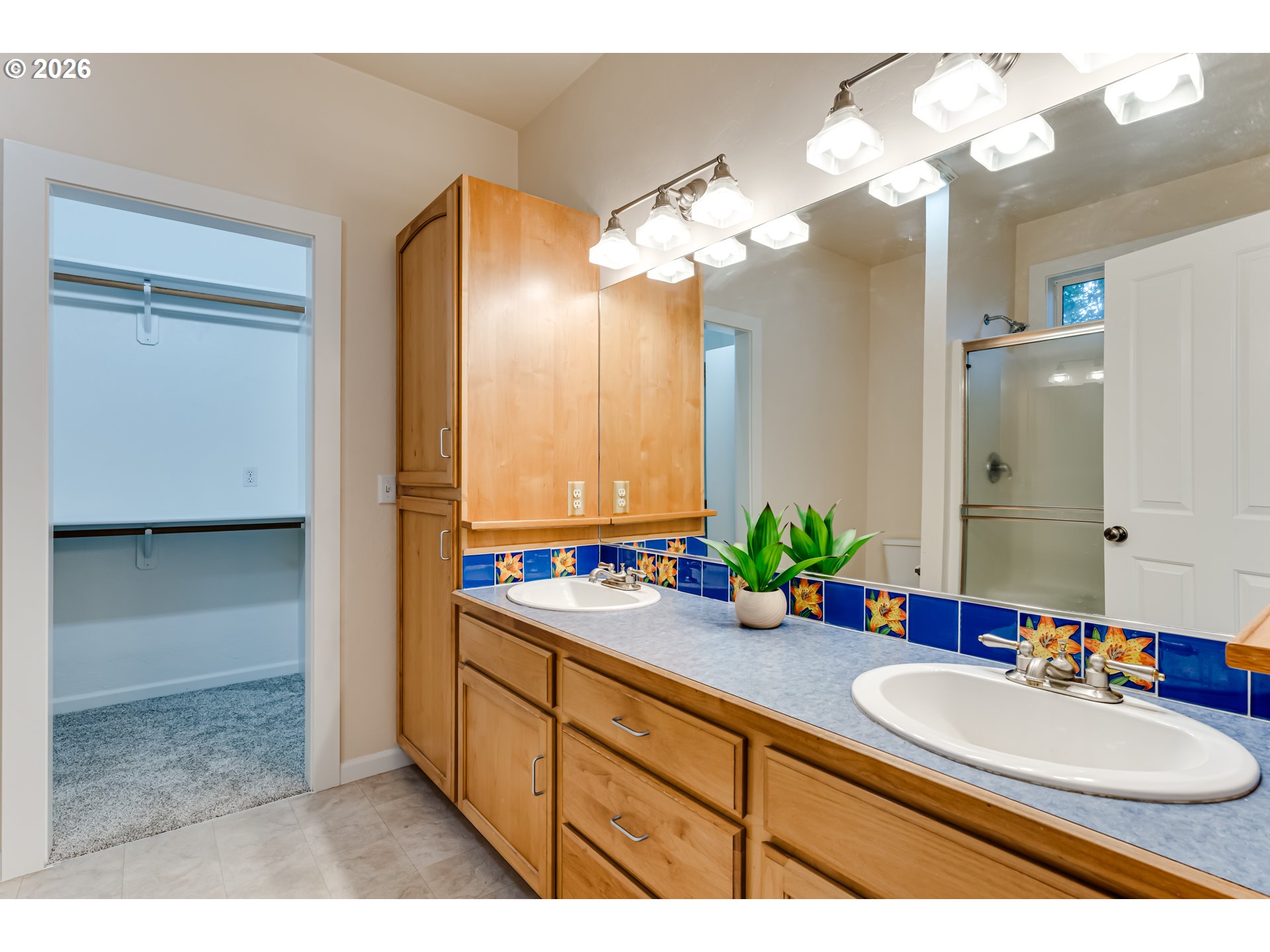 3769 Julia Loop Eugene, OR 97404 - Photo 17 of 46 a bathroom with a double vanity sink and a mirror