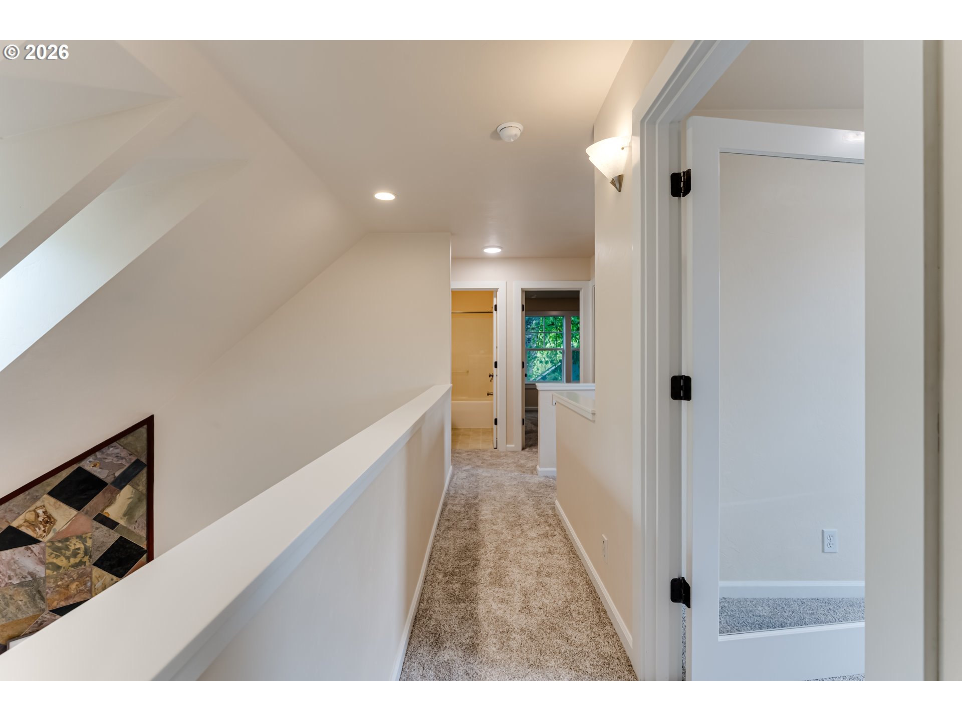 3769 Julia Loop Eugene, OR 97404 - Photo 20 of 46 a view of a hallway with wooden floor and staircase