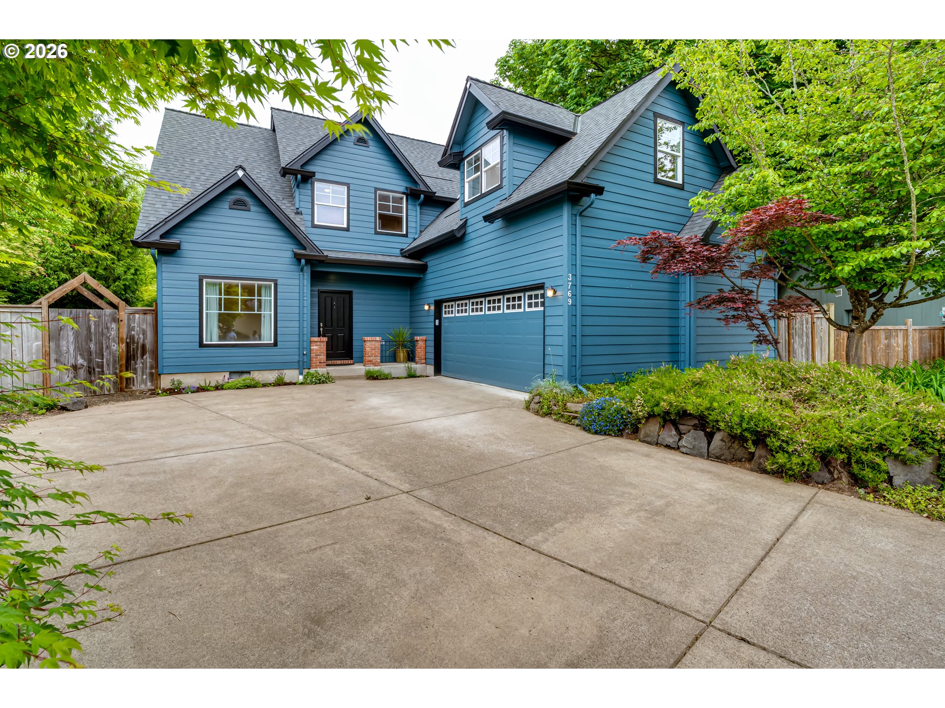 3769 Julia Loop Eugene, OR 97404 - Photo 2 of 46 a view of a house with a yard and potted plants