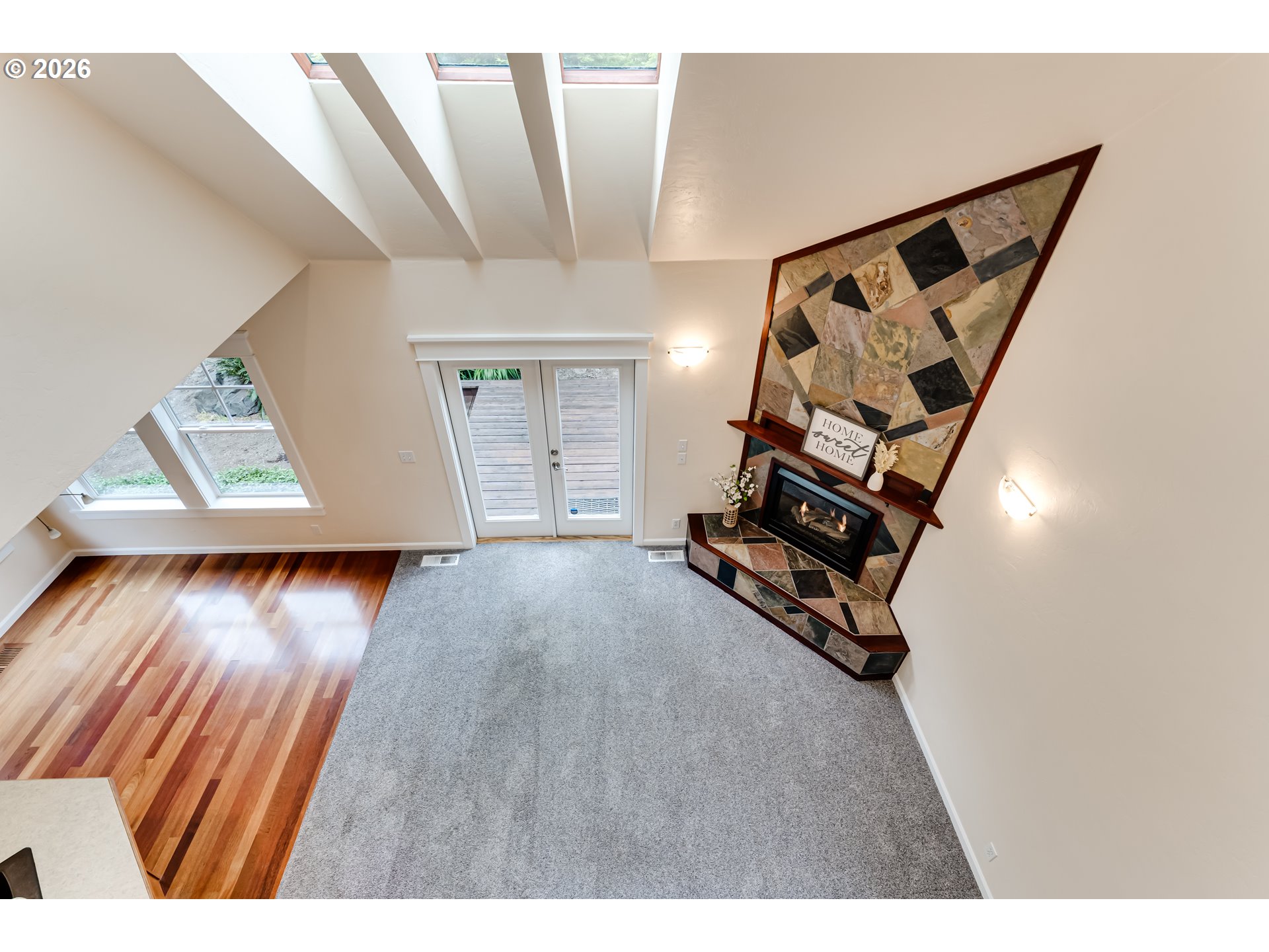 3769 Julia Loop Eugene, OR 97404 - Photo 21 of 46 a view of an empty room with wooden floor and stairs