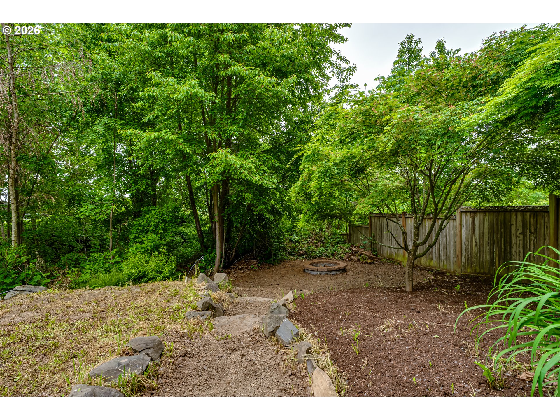 3769 Julia Loop Eugene, OR 97404 - Photo 42 of 46 a view of a yard with plants and a tree