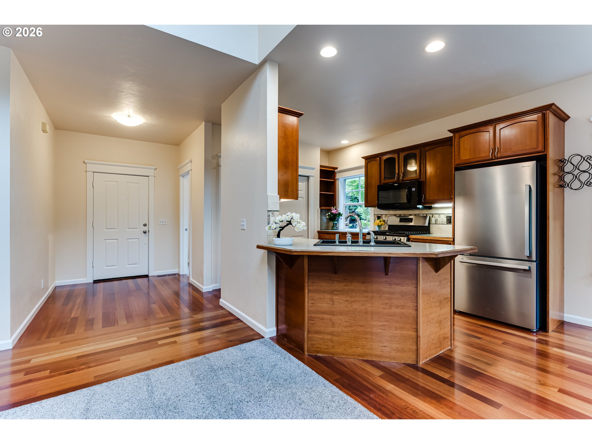 3769 Julia Loop Eugene, OR 97404 - Photo 7 of 46 a kitchen with kitchen island a refrigerator and a stove