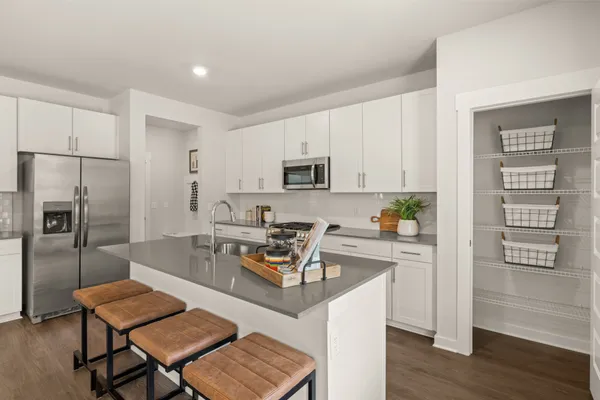 a bedroom with two beds and a couch