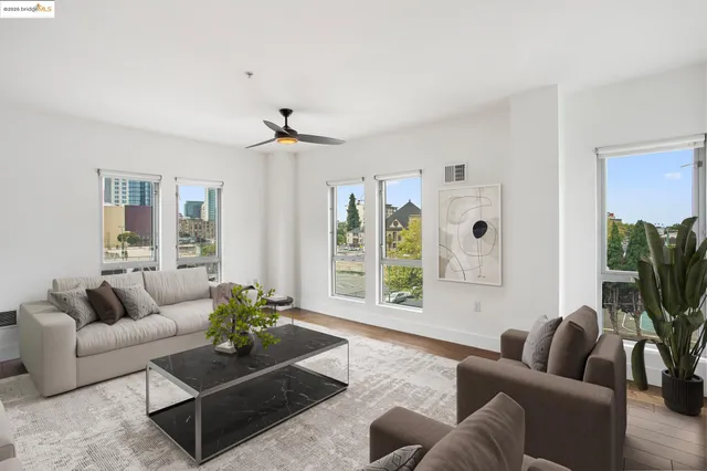 a living room with furniture and a large window