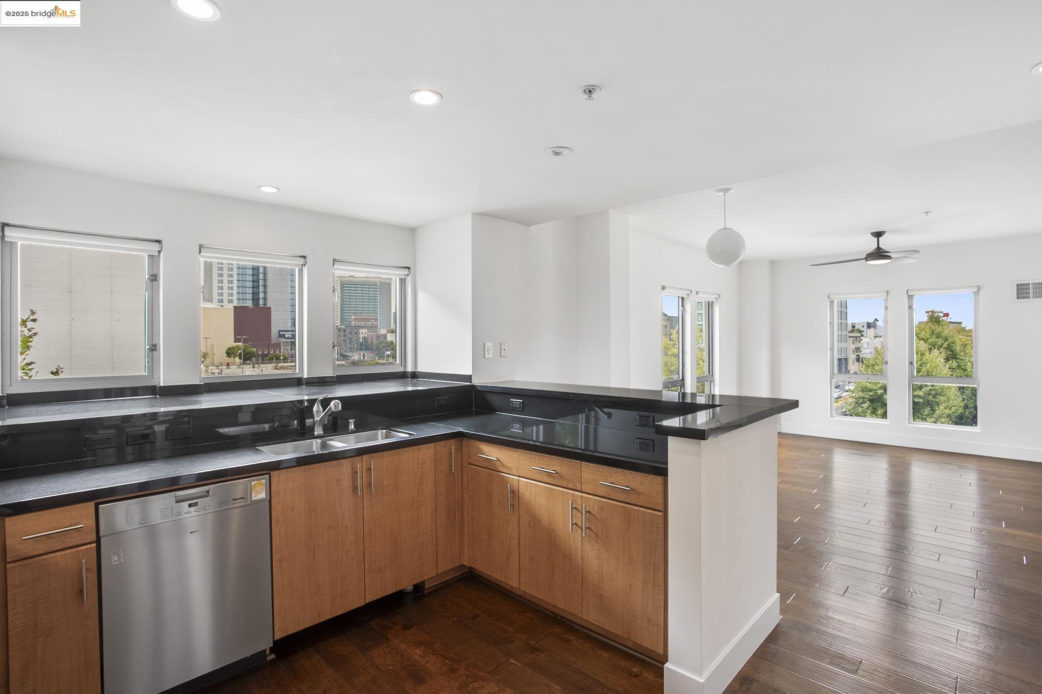 438 West Grand Avenue, Unit 401 Oakland, CA 94612 - Photo 30 of 30 a kitchen with a sink and cabinets