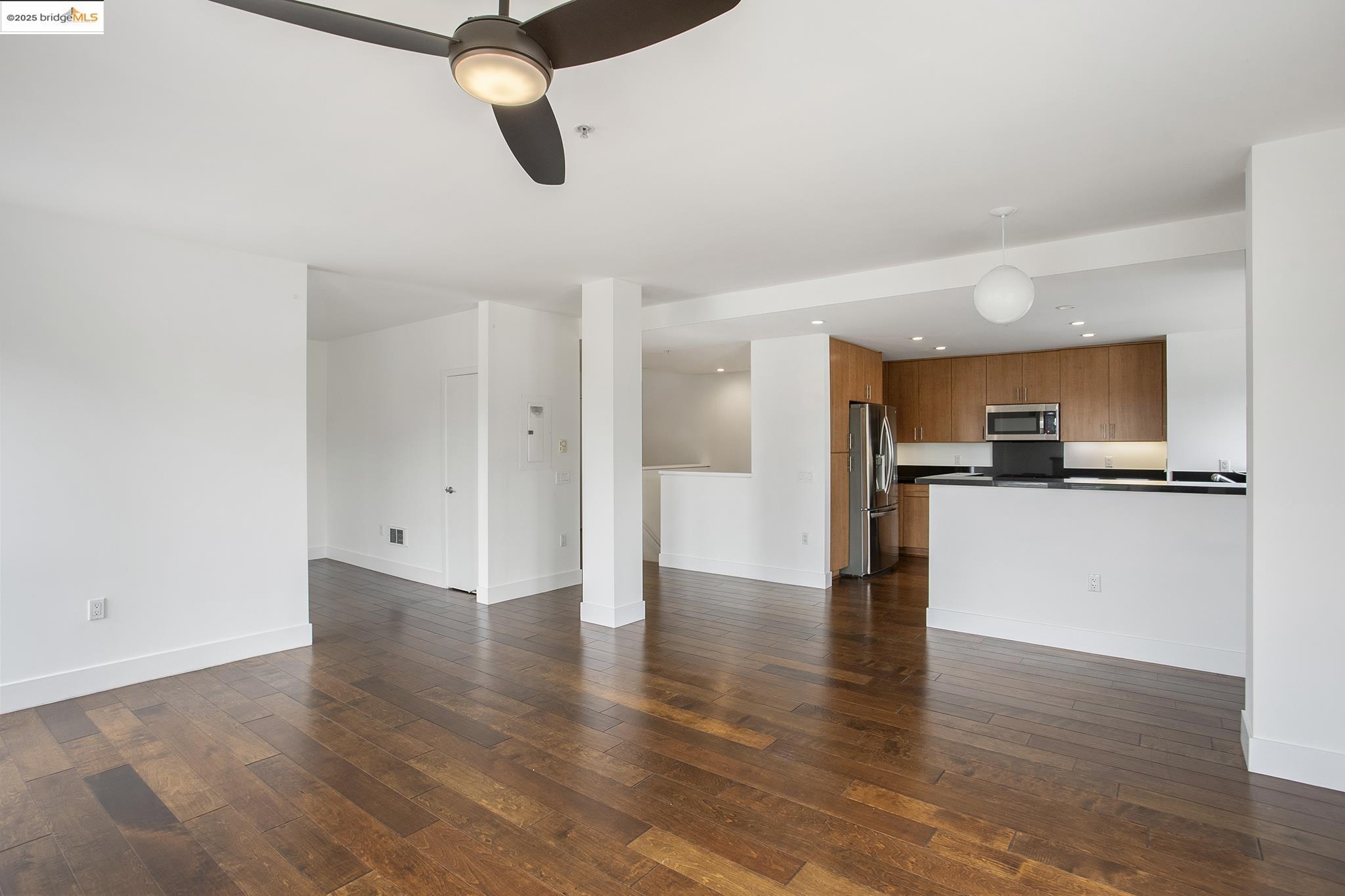 438 West Grand Avenue, Unit 401 Oakland, CA 94612 - Photo 11 of 30 a view of a kitchen with a sink and stainless steel appliances