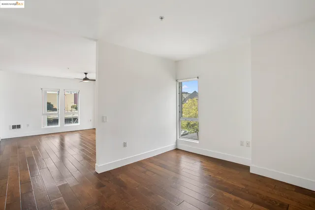 a view of a kitchen with a sink and stainless steel appliances
