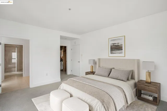 a bedroom with a bed and a potted plant