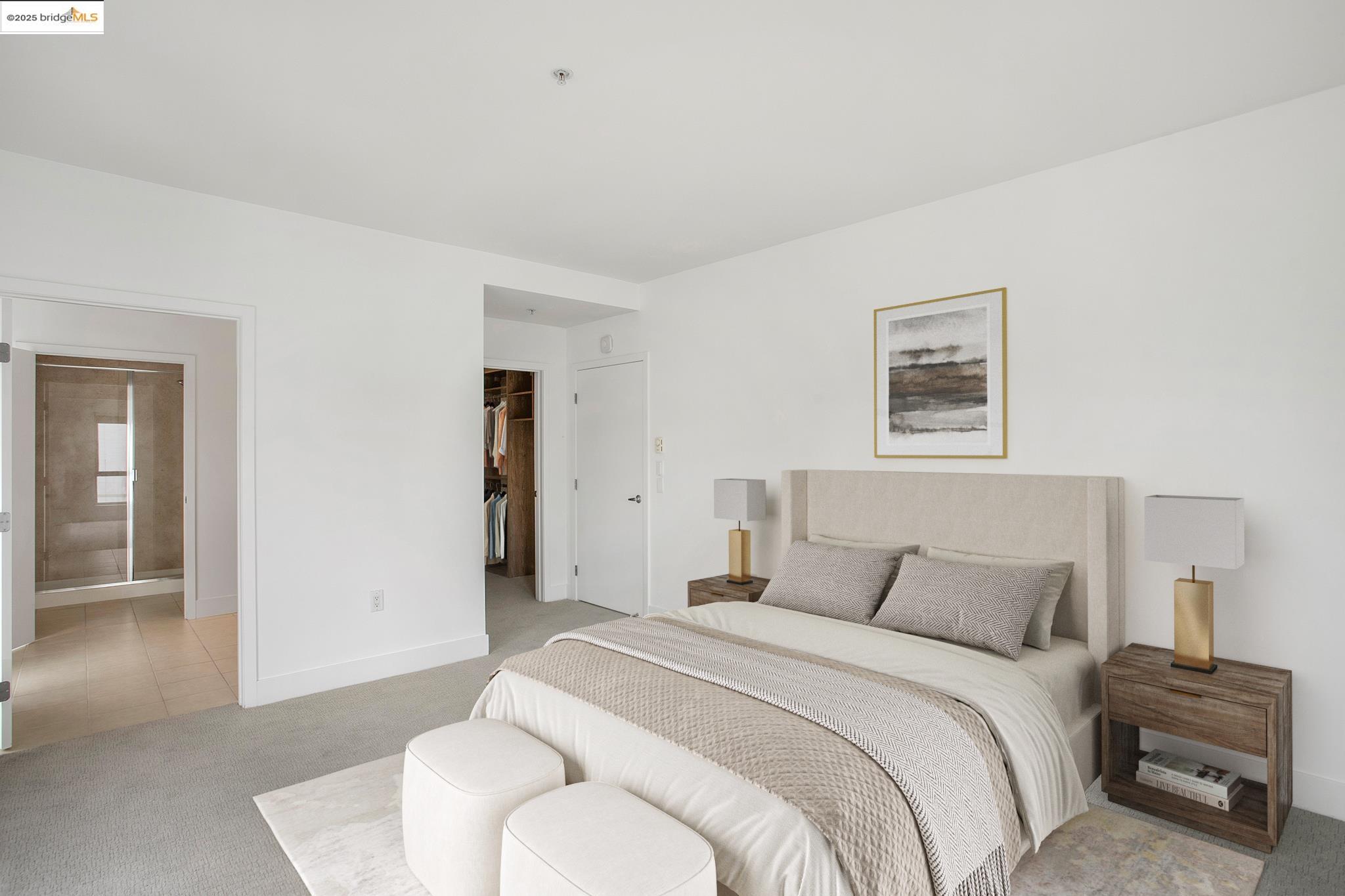 438 West Grand Avenue, Unit 401 Oakland, CA 94612 - Photo 15 of 30 a bedroom with a bed and a couch