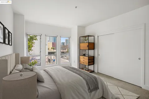 a bedroom with a bed and a couch