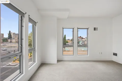 a bedroom with a bed and a cabinets
