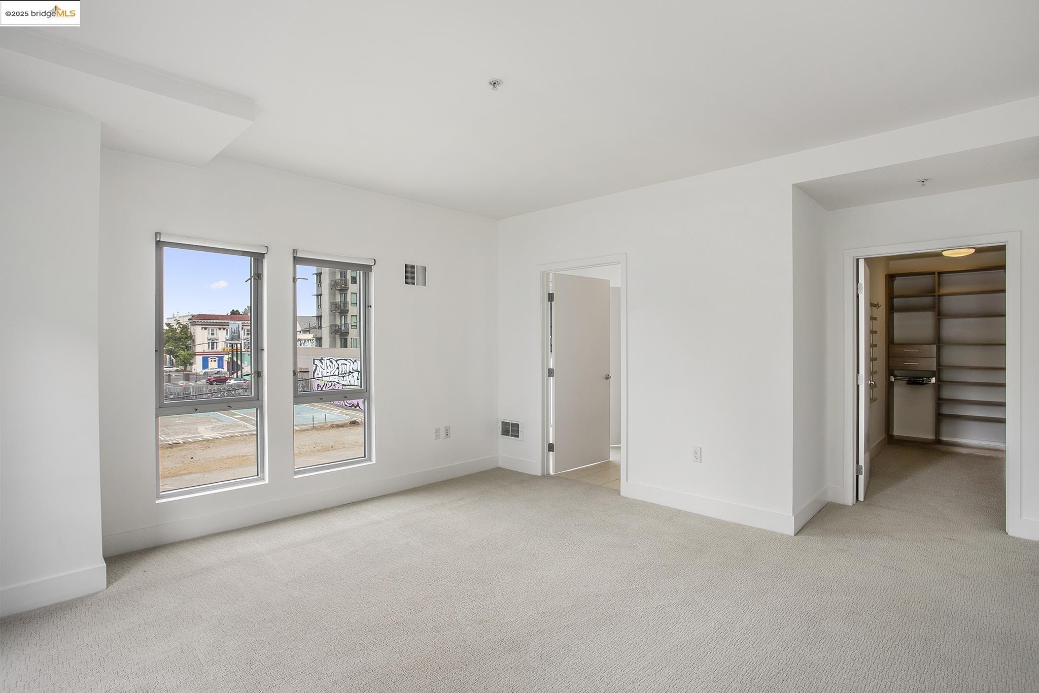 438 West Grand Avenue, Unit 401 Oakland, CA 94612 - Photo 18 of 30 a view of an empty room with a window