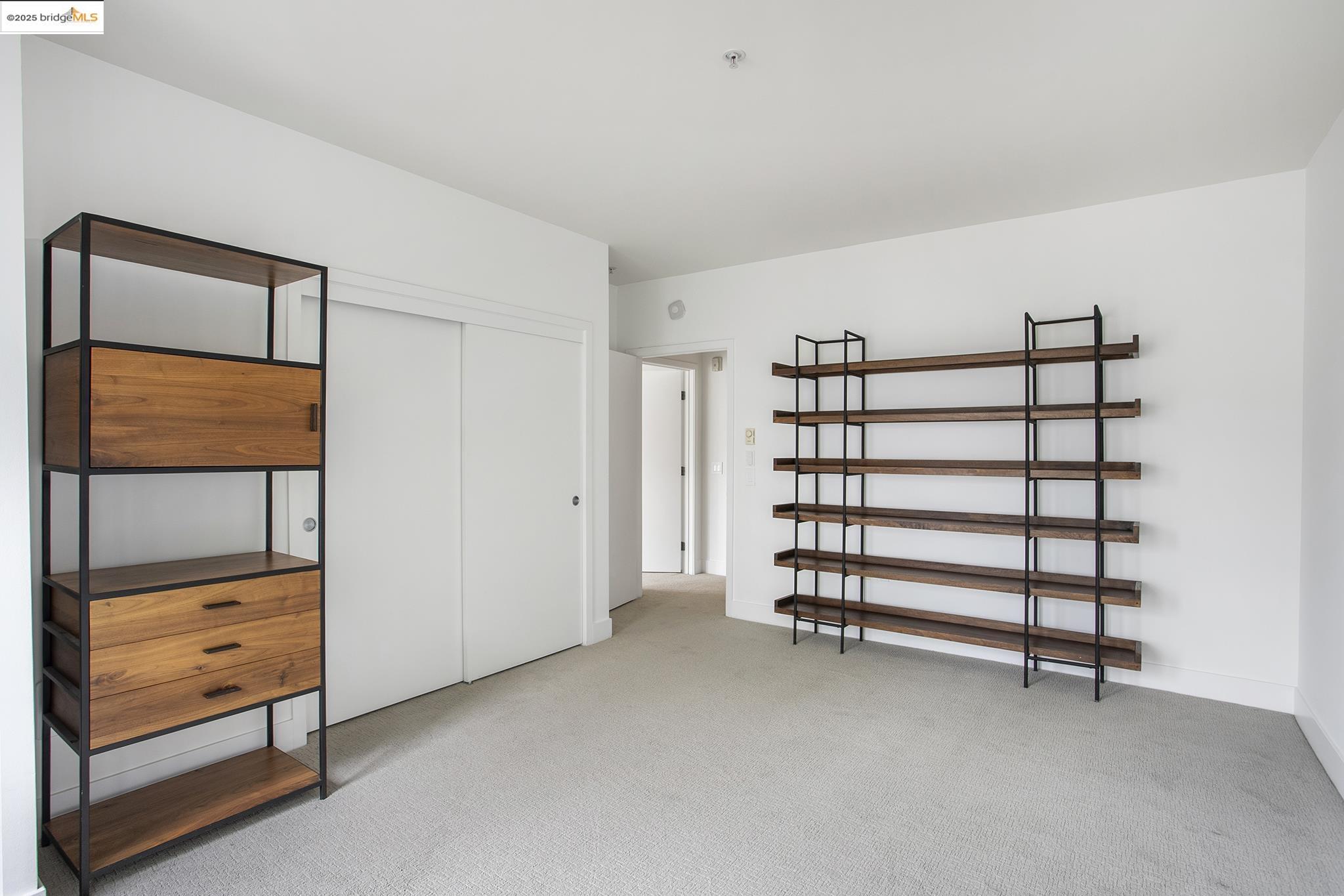 438 West Grand Avenue, Unit 401 Oakland, CA 94612 - Photo 24 of 30 a view of an empty room with cabinet and mirrors