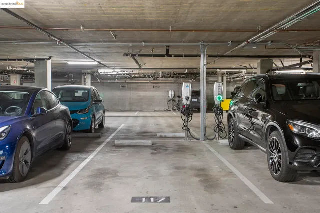 a view of parking garage with cars