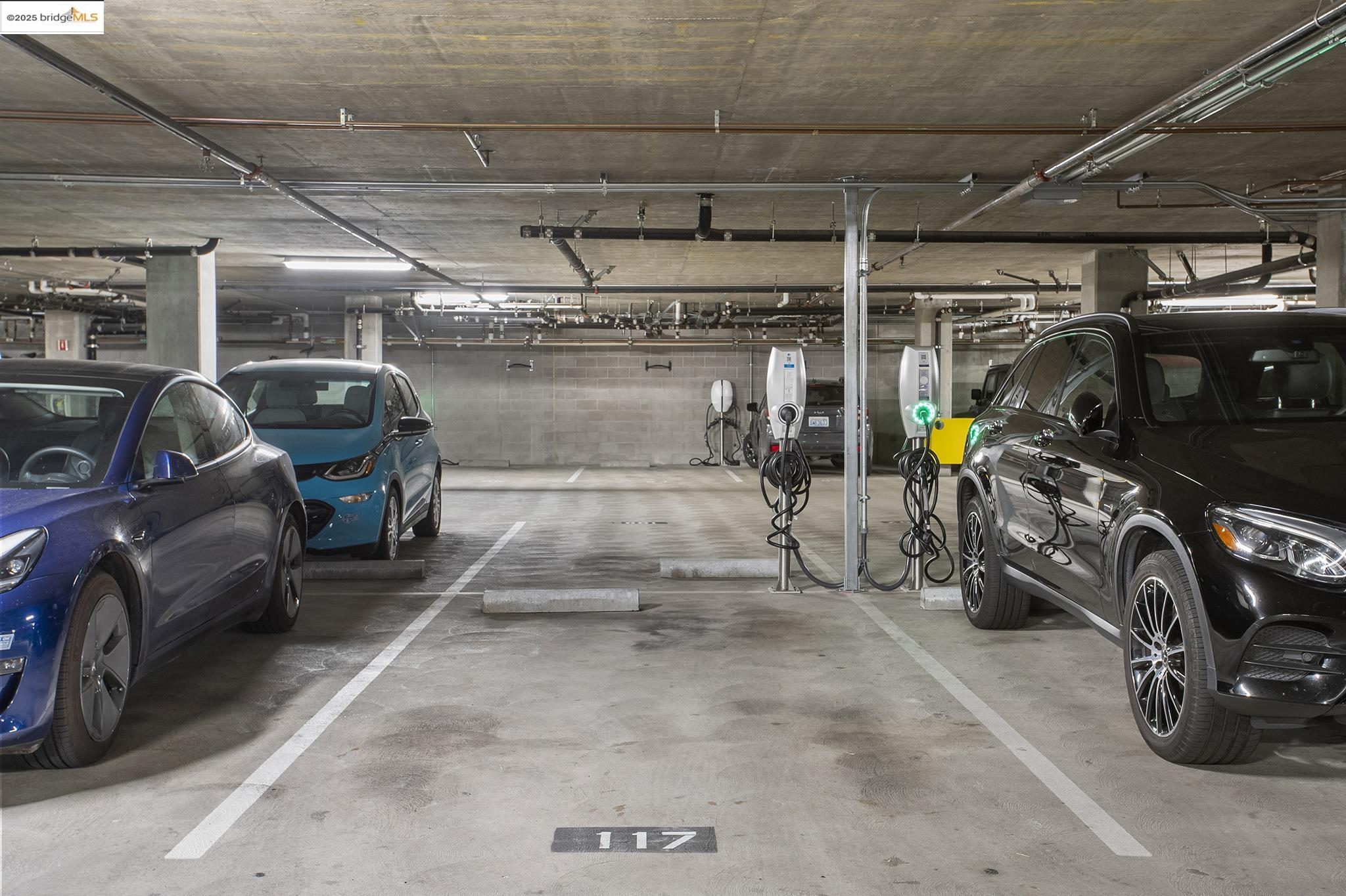 438 West Grand Avenue, Unit 401 Oakland, CA 94612 - Photo 28 of 30 a view of parking garage with cars