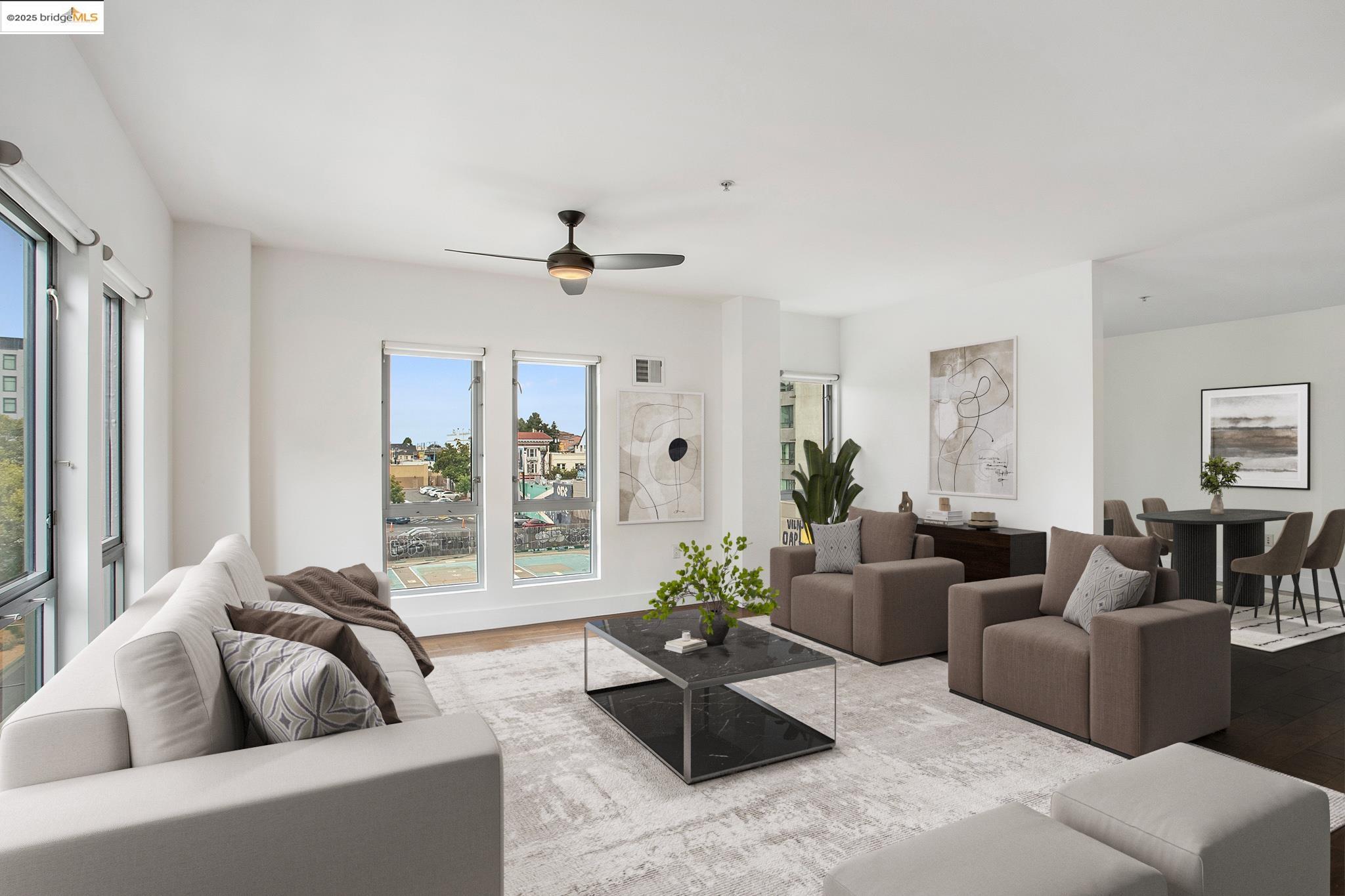 438 West Grand Avenue, Unit 401 Oakland, CA 94612 - Photo 3 of 30 a living room with furniture and a large window