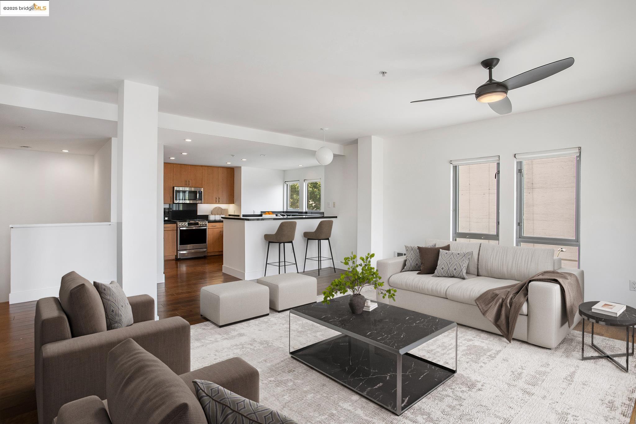438 West Grand Avenue, Unit 401 Oakland, CA 94612 - Photo 4 of 30 a living room with furniture and view of kitchen