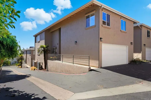 a backyard of a house with garage and garage