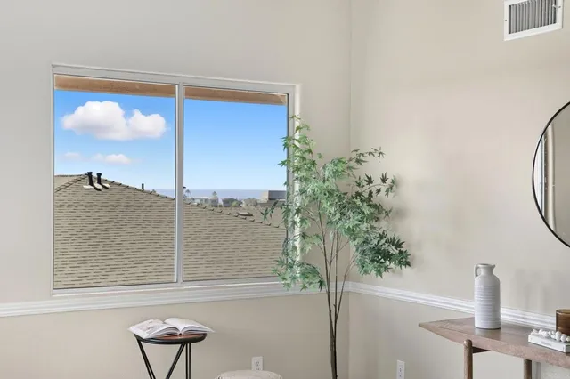 a view of a balcony with chair and table