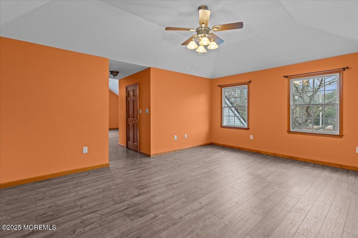 73 Porter Road Howell, NJ 07731 - Photo 2 of 65 a view of an empty room with a window and wooden floor