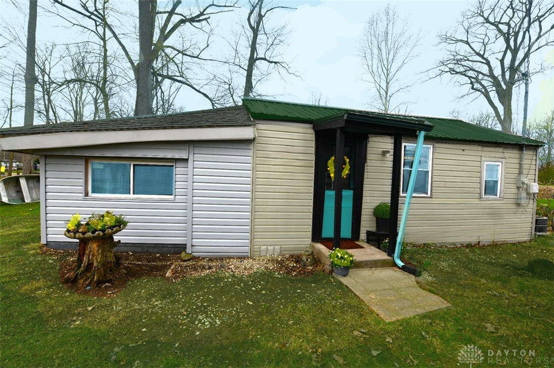 5445 Behm Road, Unit 15 Celina, OH 45822 - Photo 2 of 49 This charming home offers a simple facade with practical siding and a welcoming entryway.