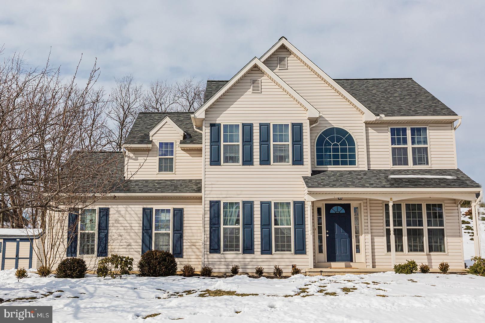 a view of a white house with a large windows