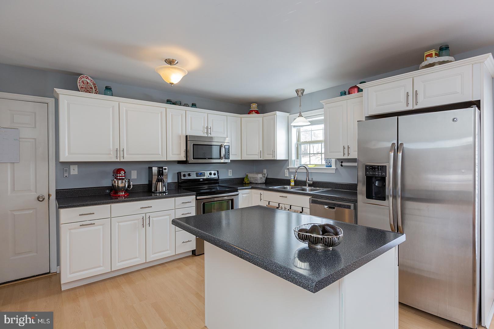 2249 Spring Valley Road Lancaster, PA 17601 - Photo 21 of 75 a kitchen with kitchen island a sink stove and refrigerator