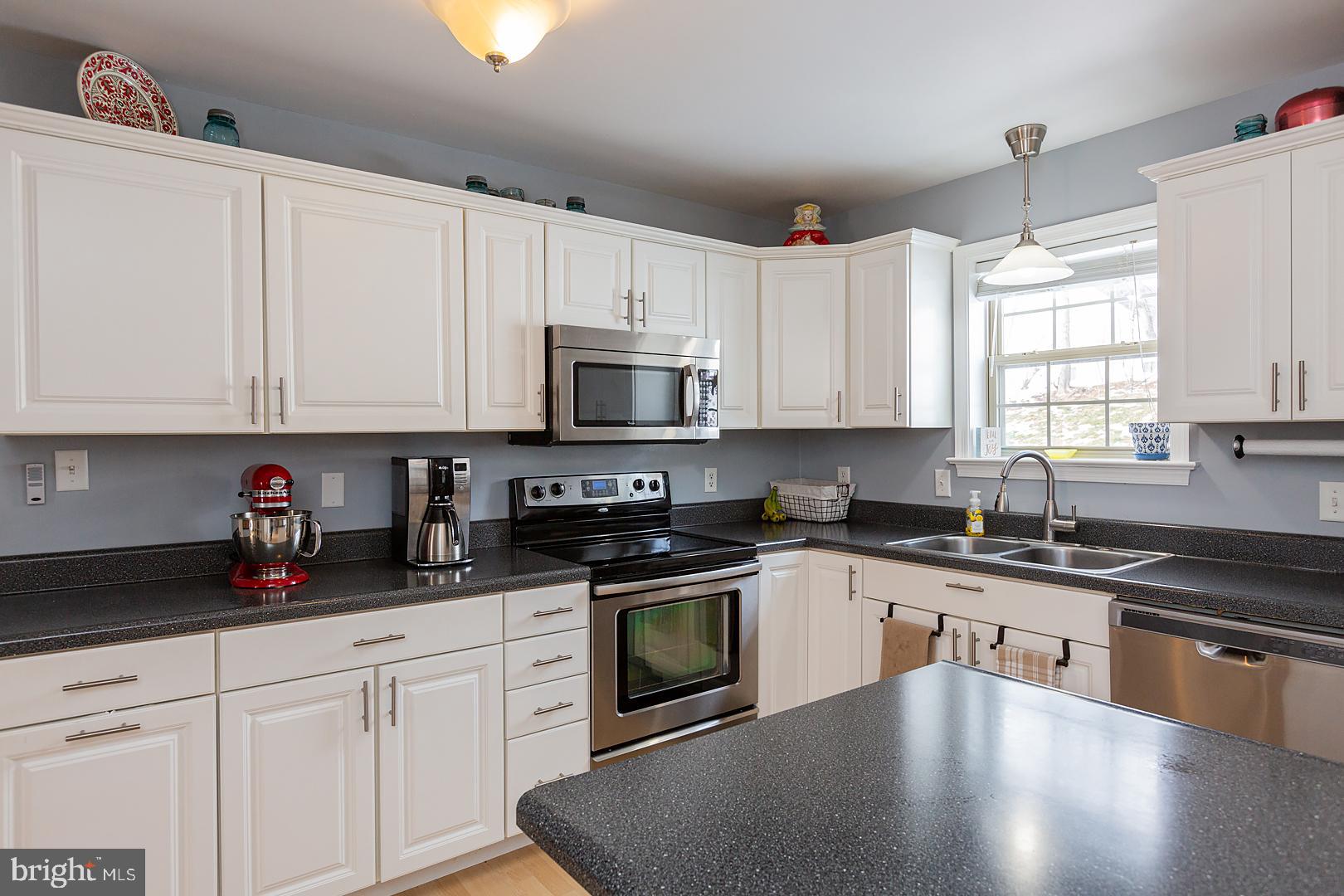 2249 Spring Valley Road Lancaster, PA 17601 - Photo 22 of 75 a kitchen with granite countertop white cabinets and white appliances