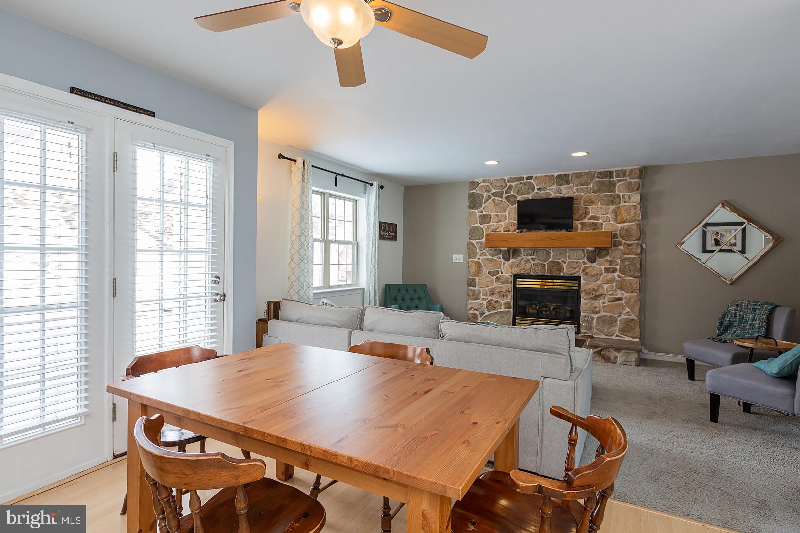 2249 Spring Valley Road Lancaster, PA 17601 - Photo 25 of 75 a living room with furniture a fireplace and a flat screen tv