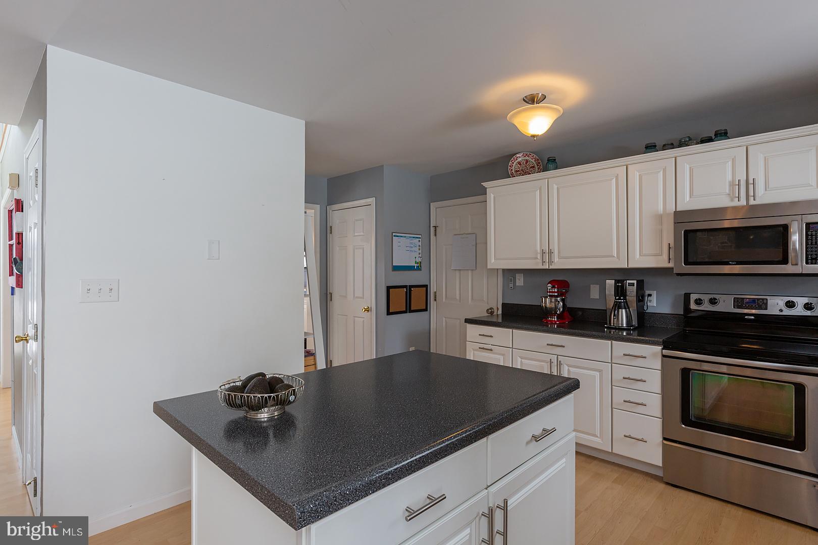2249 Spring Valley Road Lancaster, PA 17601 - Photo 27 of 75 a kitchen with granite countertop white cabinets and stainless steel appliances