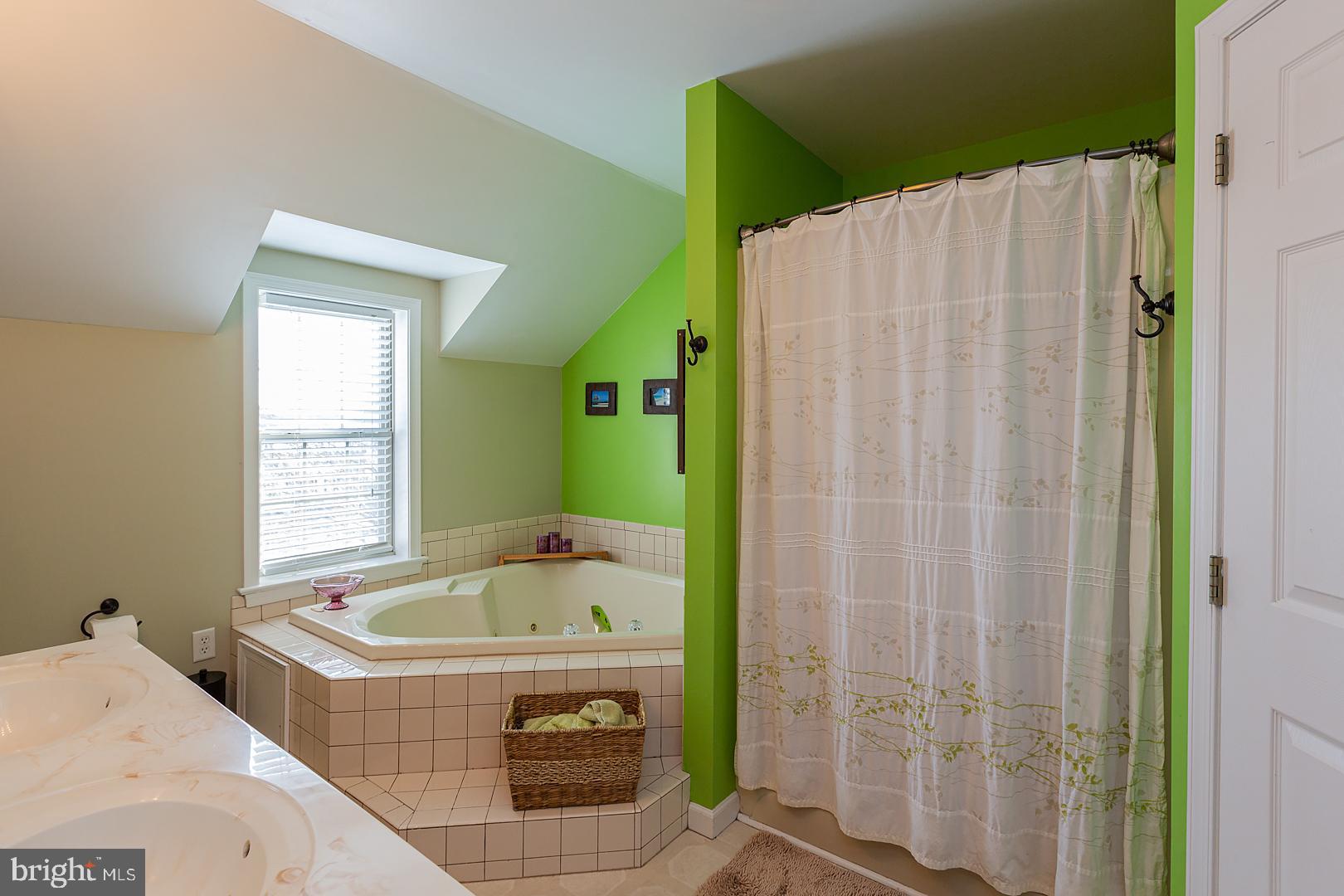 2249 Spring Valley Road Lancaster, PA 17601 - Photo 42 of 75 a bath tub sitting in a bathroom next to a window