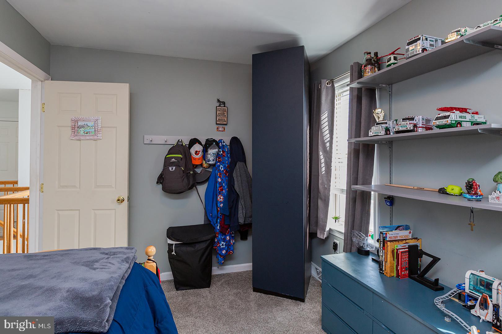 2249 Spring Valley Road Lancaster, PA 17601 - Photo 48 of 75 a bedroom with a bed and cabinets