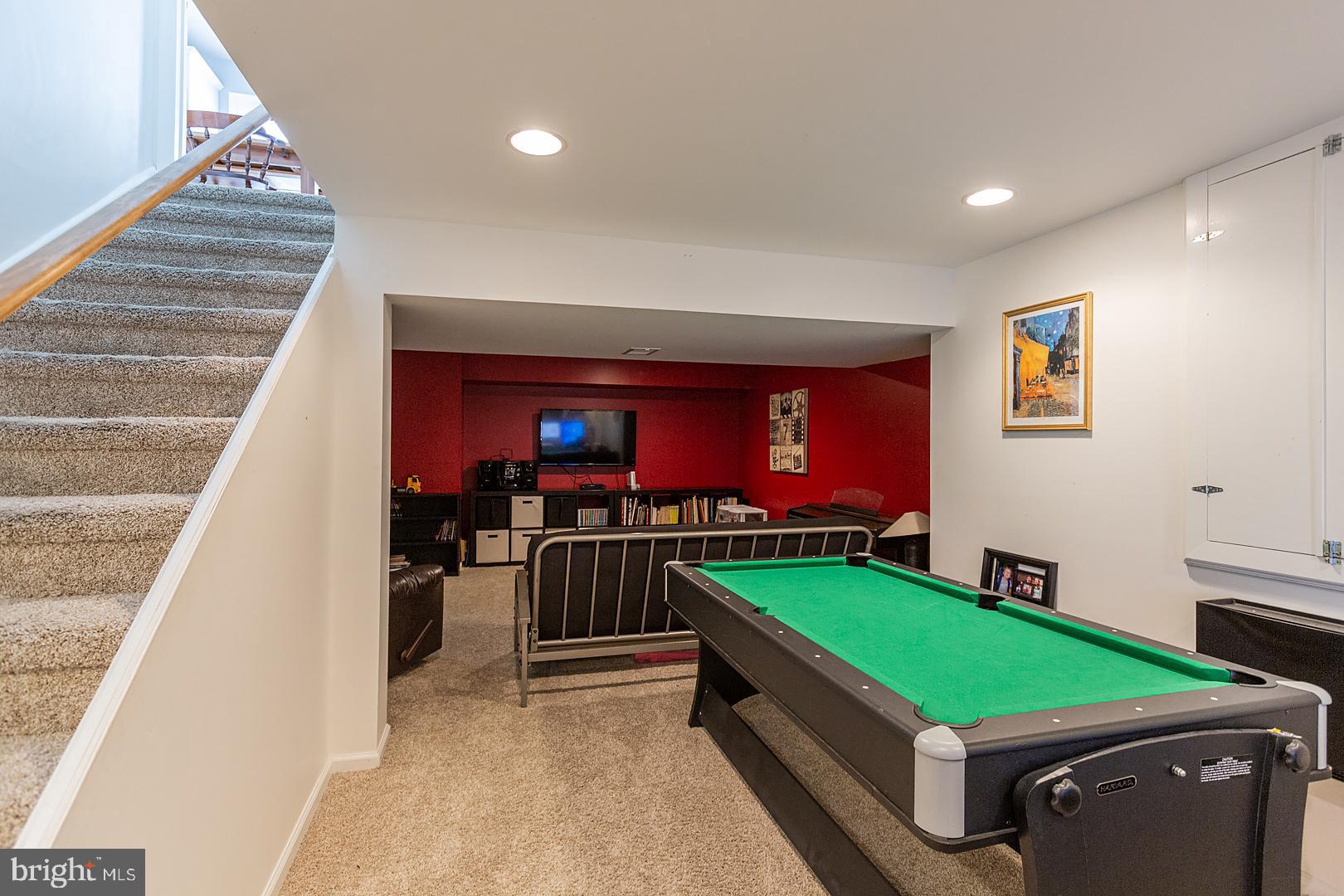 2249 Spring Valley Road Lancaster, PA 17601 - Photo 58 of 75 a room with pool table two couches and a dining table with wooden floor