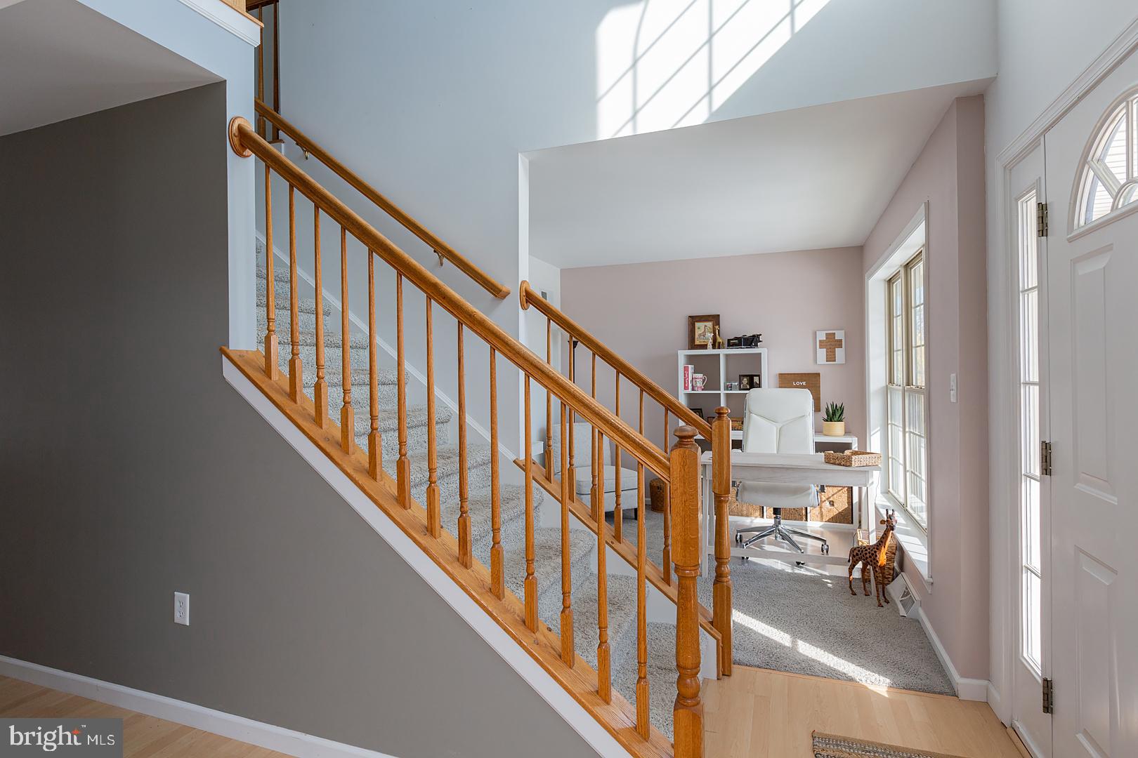 2249 Spring Valley Road Lancaster, PA 17601 - Photo 7 of 75 a view of a hallway with wooden floor and stairs