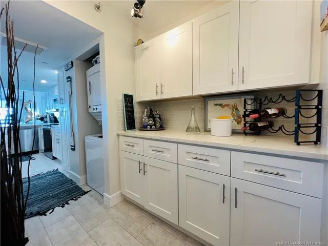 a living room with furniture a rug and a ceiling fan