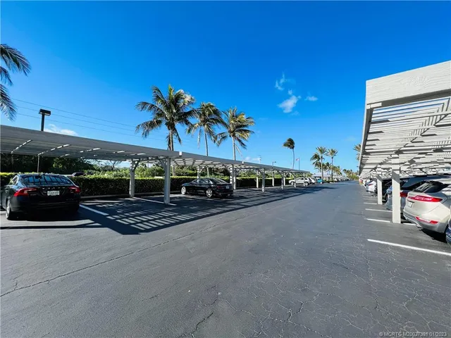 a kitchen with stainless steel appliances kitchen island granite countertop a refrigerator sink and stove