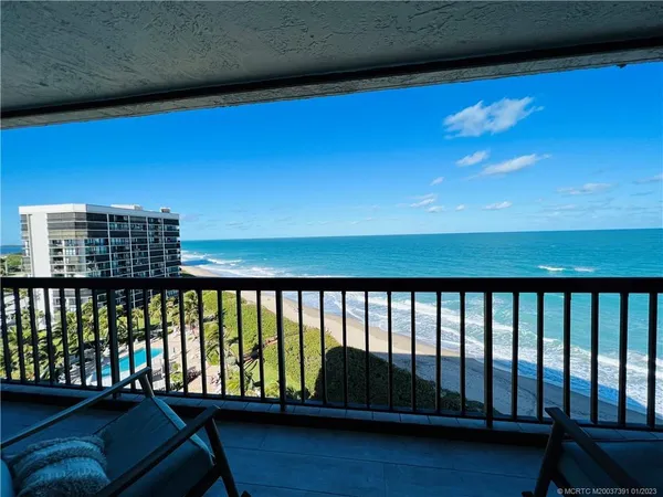 a bedroom with bed tv and window