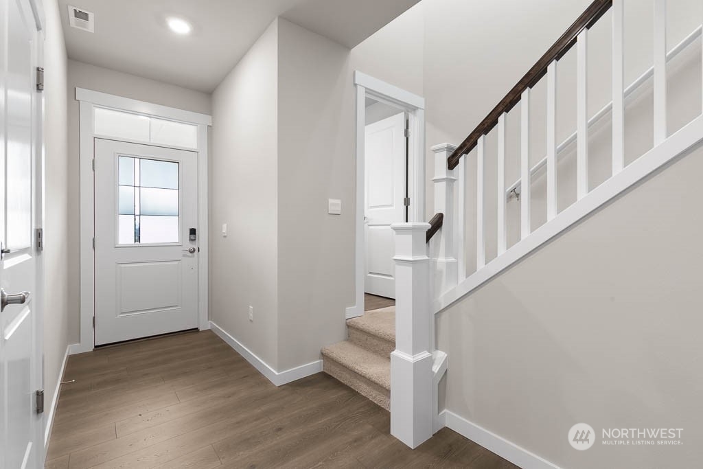 4419 228th Place South East, Unit MC18 Bothell, WA 98021 - Photo 2 of 35 a view of entryway with stairs and wooden floor