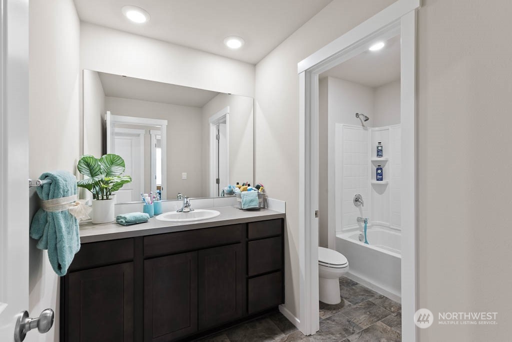 4419 228th Place South East, Unit MC18 Bothell, WA 98021 - Photo 27 of 35 a bathroom with a double vanity sink toilet and shower