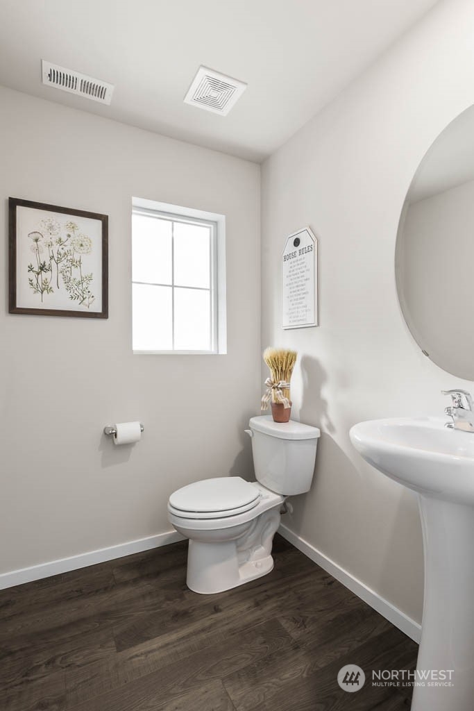 4419 228th Place South East, Unit MC18 Bothell, WA 98021 - Photo 4 of 35 a bathroom with a toilet a sink and a mirror