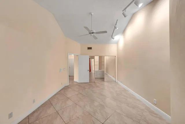 a bathroom with a shower sink and mirror