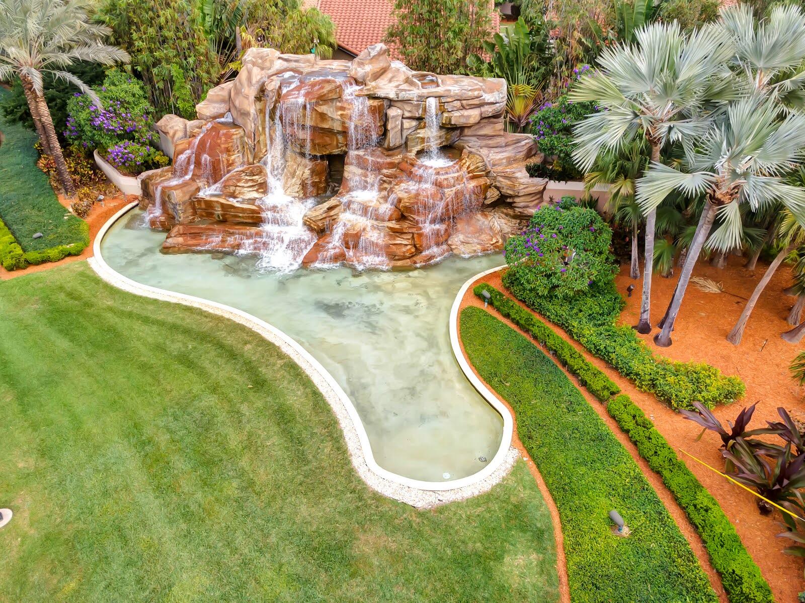 6698 Montego Bay Boulevard, Unit F Boca Raton, FL 33433 - Photo 30 of 34 WATERFALL/SW 18TH STREET ENTRANCE