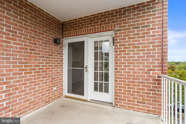 a living room with flat screen tv and a window