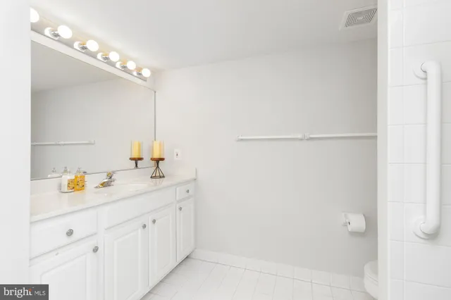 a view of a bathroom from a hallway