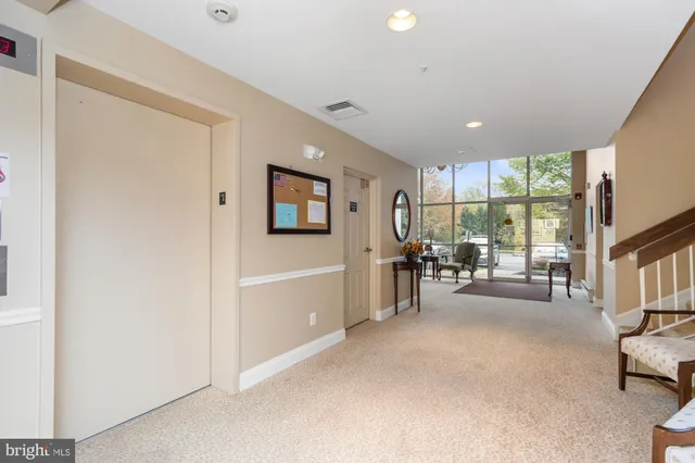 a view of a livingroom with furniture and a window