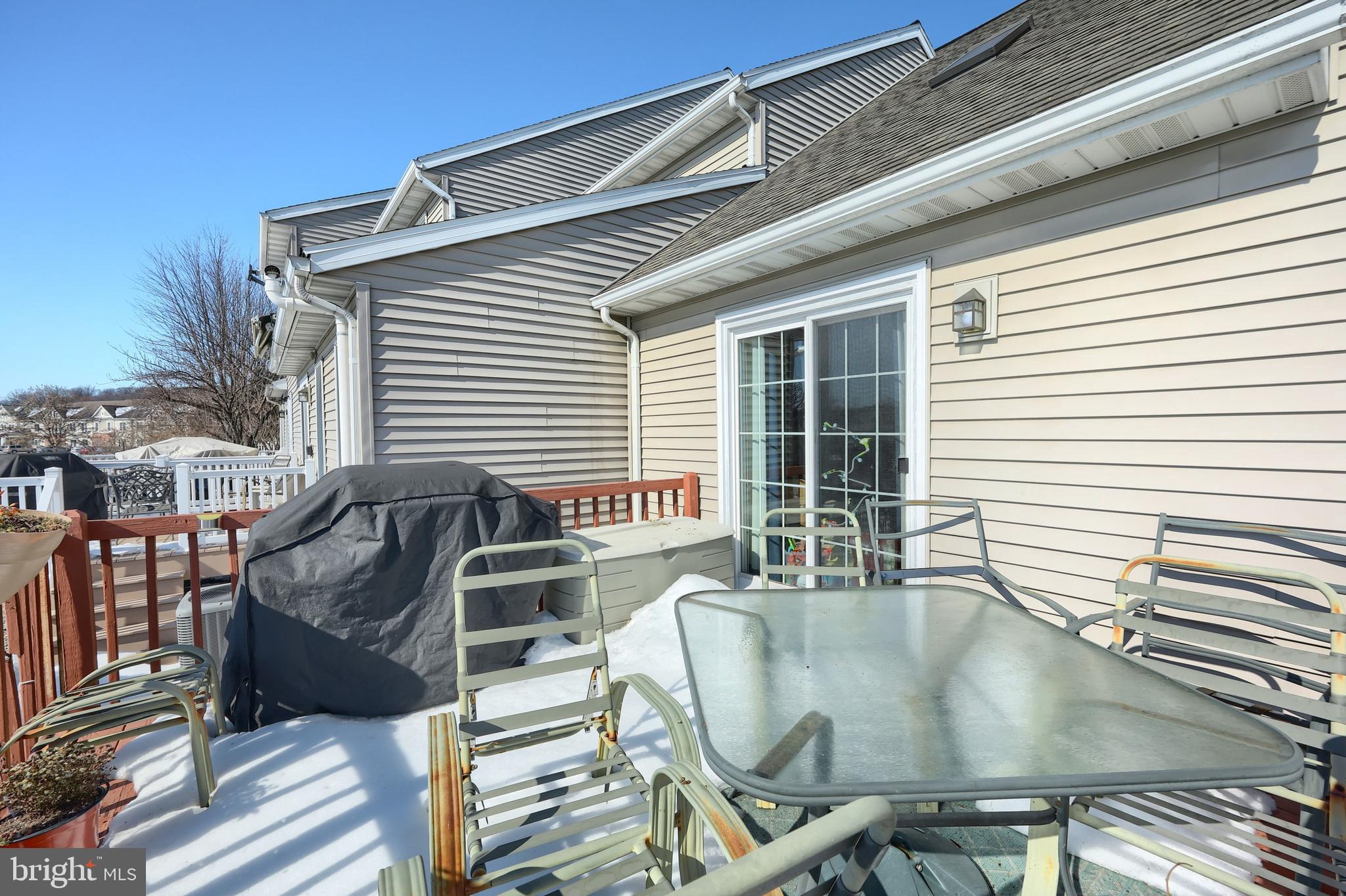 39 Spring Hill Lane Mountville, PA 17554 - Photo 27 of 28 a view of a deck with table and chairs with wooden floor and fence