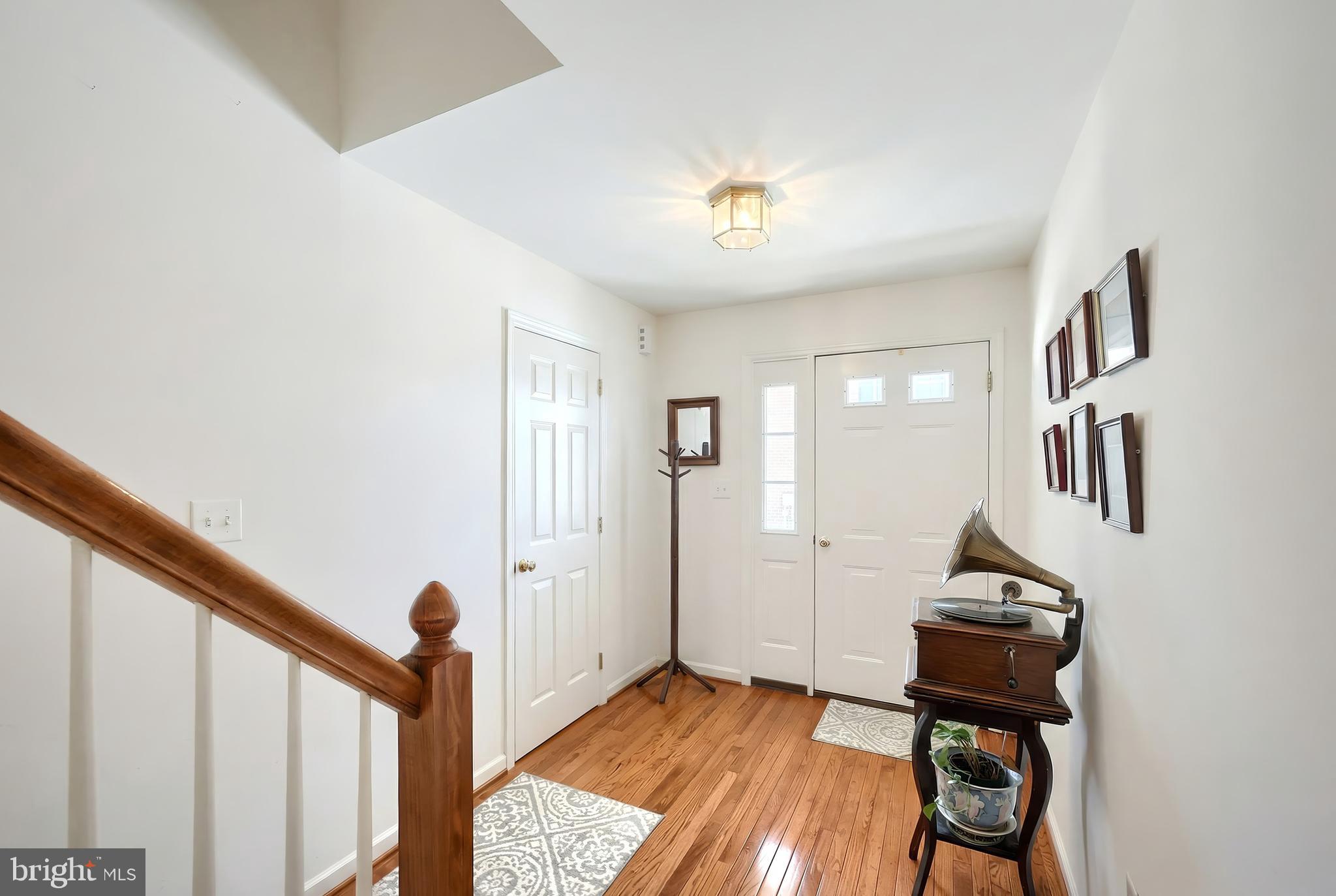 39 Spring Hill Lane Mountville, PA 17554 - Photo 5 of 28 a view of a hallway with wooden floor and staircase