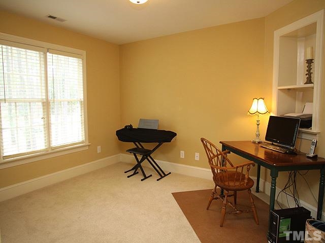236 Release Circle Raleigh, NC 27615 - Photo 11 of 25 a workspace with furniture and a window