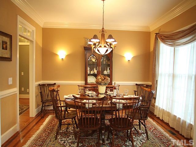 236 Release Circle Raleigh, NC 27615 - Photo 4 of 25 a view of a dining room with furniture window and wooden floor